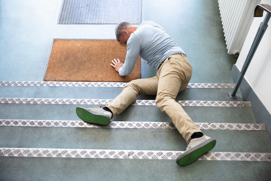 Man on floor after falling down stairs