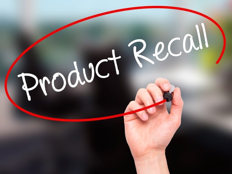 Hand writing the text Product Recall and circling it in red marker